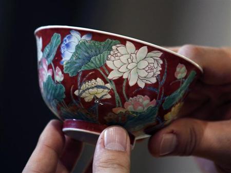 KANGXI BOWL SELLS FOR 9.5 MILLION A magnificent Ruby-Ground Falangcai "Double-Lotus" Bowl Blue Enamel Yuzhi Mark and Period of Kangxi is shown after Hong Kong Chinese ceramics dealer William Chak has bought it for HK$74 million ($9.5 million) at Sotheby's Spring Sales in Hong Kong April 8, 2013. Sotheby's said in a press release the deal set a world auction record for Qing Kangxi porcelain. REUTERS/Bobby Yip