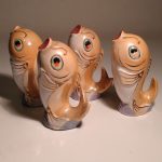 Chinese Fish x 4 golden colour in the form of salt and pepper shakers amazing