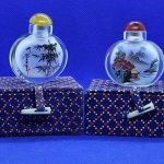 A BEAUTIFUL PAIR OF ANTIQUE/VINTAGE CHINESE SNUFF BOTTLES. BOXED. LOVELY ITEMS.