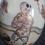 Vintage Chinese porcelain oval ornament with gold accents, signed on base Vintage Chinese porcelain oval ornament with gold accents, signed on base