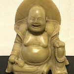 Vintage or earlier Oriental light green stone smiling Buddha. Nicely carved.