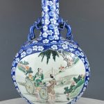 Blue and white chinese porcelain vase with famille verte figures painting