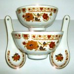TWO Chinese bowls and spoons FLORAL DESIGN 110mm in diameter APPROX TWO Chinese bowls and spoons FLORAL DESIGN 110mm in diameter APPROX