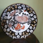 A Chinese porcelain saucer set in brass A Chinese porcelain saucer set in brass