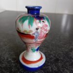 small vintage Chinese painted porcelain vase with gold effects small vintage Chinese painted porcelain vase with gold effects