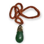 A FINE ANTIQUE CHINESE JADE GREEN PEKING GLASS PENDANT ON CORAL 19th C A FINE ANTIQUE CHINESE JADE GREEN PEKING GLASS PENDANT ON CORAL 19th C
